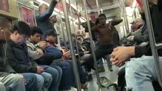 Subway dancers spin and flip using hand rail poles