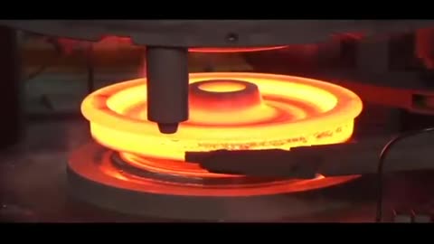 Train wheel production process with an automated forging line