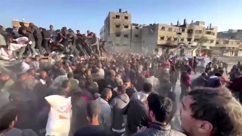 People rush for flour after aid truck enters Gaza City