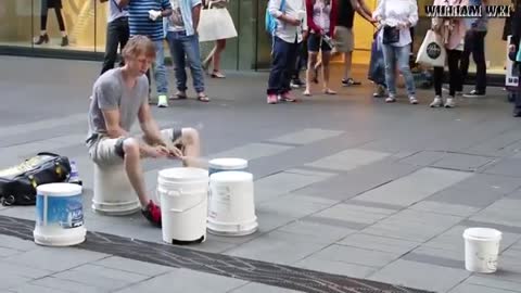 Street performer displays amazing drumming skills