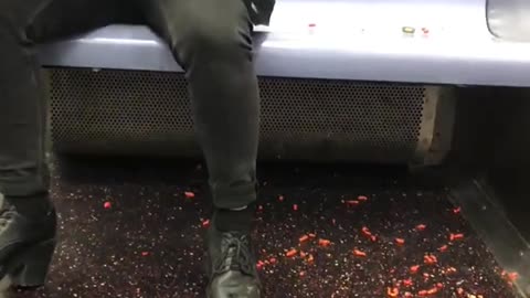 Drunk girl on subway eats hot cheetos off floor