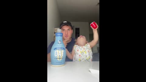 Hard drinking: Funny uncle and his toddler niece are taking shots of oatmilk