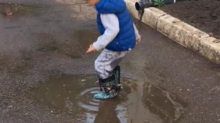 4 years old boy playing with water