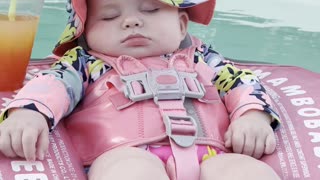 Baby Relaxes in Pool