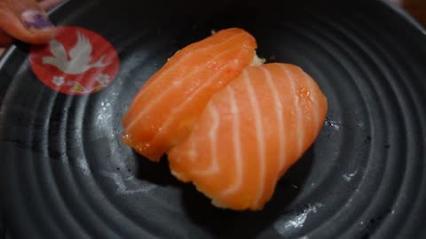 Slow motion shot of Salmon Sushi