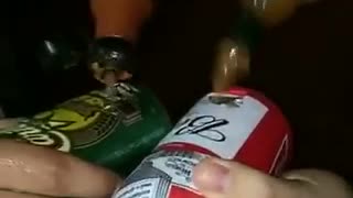 Guys putting hot sauce in beer cans