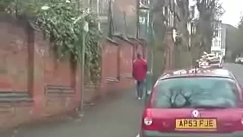 Drunk man tries to walk up street