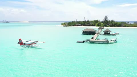 Water plane arriving to a little island