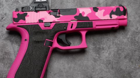 Pink and Black Woodland Cerakote on this Glock