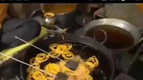 Very sweet Indian desert jalebi made with besan flour dipped in sugar syrup