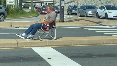 Homeless man falling asleep while asking for money