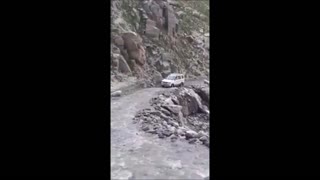 Car Makes Daring Rocky Water Cross