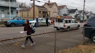 Rifle Left Leaning Against Car