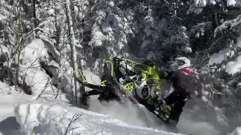 Guys Struggle To Get Snowmobile Out of Deep Snow