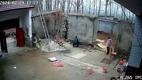 Wall collapses missing man by seconds