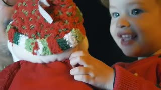 Excited girl with a stuffed Santa Claus