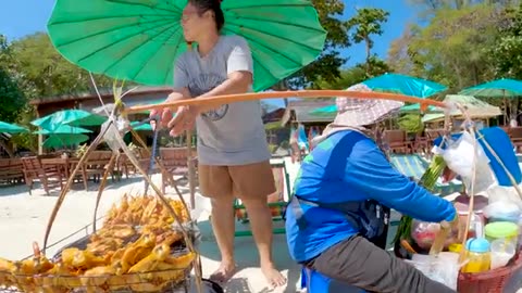 Thai Beach Food Hawker Sea Side Preparation of Papaya Salad With Crab & BBQ Chicken.