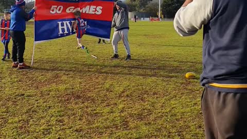 Boy Bounces Off Aussie Rules Football Celebration Banner