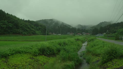 Tranquil mountain villages, turquoise fields, and mist-shrouded mountains.