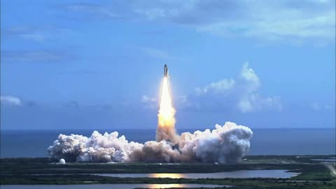 far-away-view-of-space-shuttle-lifting-off-over-water