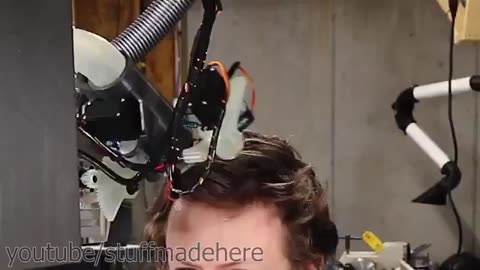 🤖Man gets a haircut from a robot