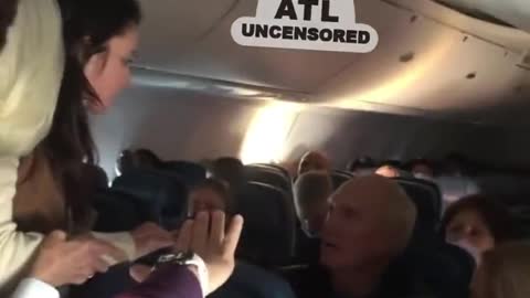 On a Flight to Atlanta a woman punches and spits on man because he didn't have a mask on