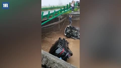 Car drives off a collapsed bridge and plunges into a crater