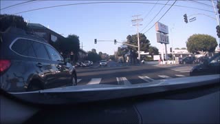 Car Runs Red Light, Narrowly Misses Traffic