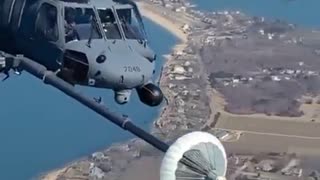 Helicopter refueling in mid air.