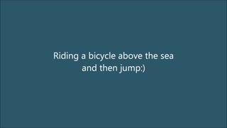 Child riding a bicycle above the sea and then jumps in