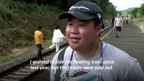 Thailand's 'floating train' a hit as dam waters rise