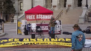 Poet Carolyn stands with Day X Denver - Free Julian Assange