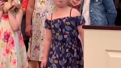 Little girl breaks out the dance Moves during a concert in their School