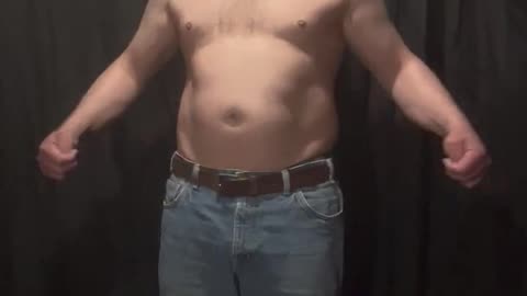 Fat man flexes his flab 12 of 14