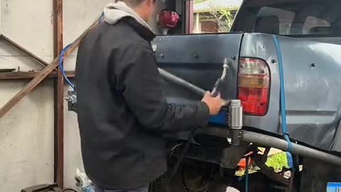 Retrofitting a truck spare tire storage rod.