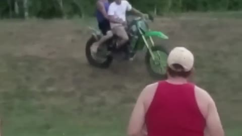 Pillion Rider Falls off Dirt Bike and Lands on the Ground