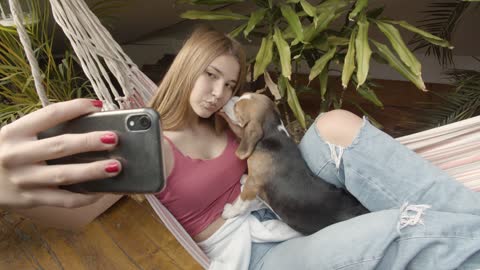 Woman Taking Selfie with Her Dog