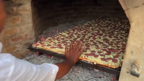 Biggest pepperoni 🍕 pizza in a huge mud oven