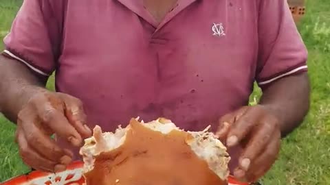 A man eating pork with spicy sauce
