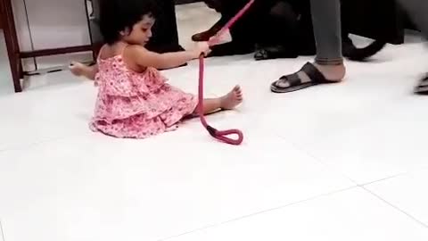 Aggressive Rottweiler playing with baby