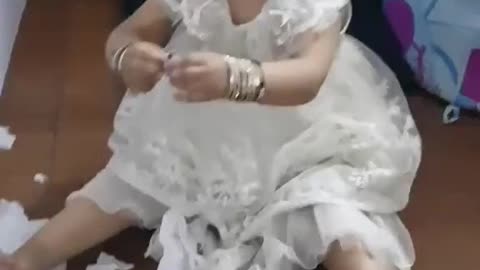 Naughty girl playing with tissue papers