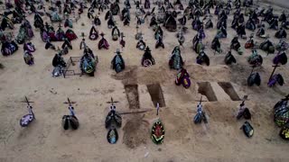 Drone shows dozens of new graves in Ukraine's Irpin