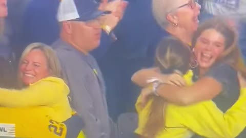 J.J. McCarthy’s dad sneaking a few feels on his son’s girlfriend