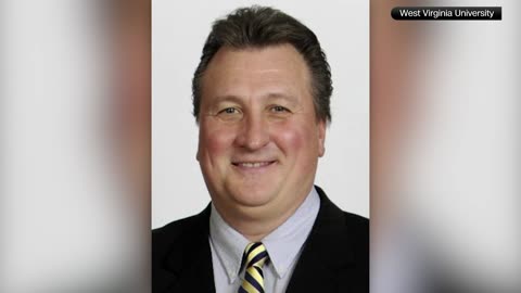 Former West Virginia University coach denies resignation, threatens to sue school