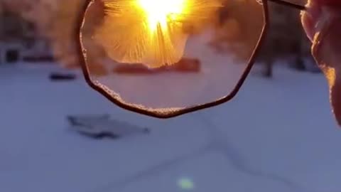 Frost Forms in DIY Bubble Wand as Person Dips It In Soap Water And Holds in Cold Weather