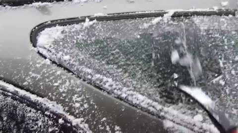 Scraping ice off the car