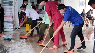 the men try to push the water so it doesn't flood