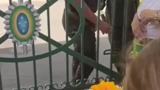 Brazil today a girl gives flowers to the military