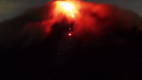 This is awesome video in time laps with stary night at volcano lava comes