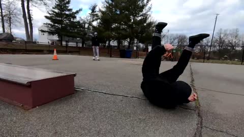 Guy Attempts To Jump Over A Skateboard Ledge But Fails